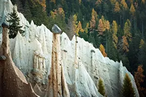 Picturesque view on natural earth pyramids in autumn season. Renon, Ritten, Dolomites, South Tyrol, Italy