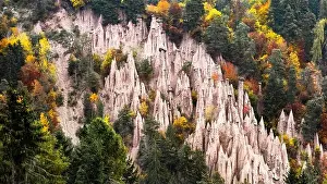 Picturesque view on natural earth pyramids in autumn season. Renon, Ritten, Dolomites, South Tyrol, Italy