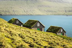 Picturesque view of tradicional faroese grass-covered houses in the village Bour during autumn. Vagar island, Faroe Islands, Denmark