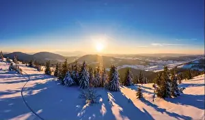 Picturesque winter panorama of snowy mountain hills