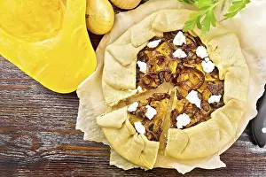 Top Down Prints: Pie of pumpkin, fried onions and soft cheese on parchment