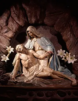 Hars Prints: A PIETA STATUE OF MARY MOTHER HOLDING DEAD BODY OF JESUS CHRIST IN HER LAP WITH WHITE LILIES