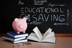 Graduate Prints: Piggy bank with books and coins on blackboard background. Educational savings concept