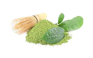 Brew Prints: Pile of green matcha powder, leaves and bamboo whisk isolated on white