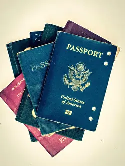 Citizenship Prints: a pile of old passports