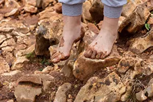 Barefooted Prints: A pilgrim walking barefoot on Mount Podbrdo (Apparition Hill) in Medjugorje