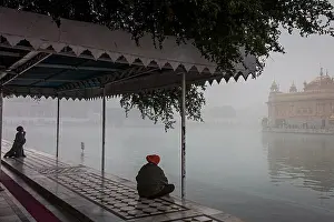 Reflecting Prints: pilgrims and sacred pool Amrit Sarovar, Golden temple, Amritsar, Punjab, India