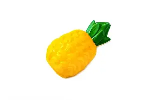 Pineapple. Toy plastic fruit isolated on white background. Plastic fruit for the game. Playing at the kids store