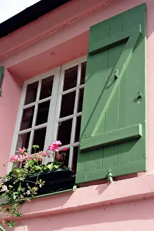 Shutters Prints: A pink painted house with green painted shutters in Montmartre, Paris