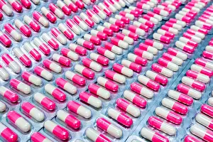 Medicament Prints: Pink-white antibiotic capsule pills in blister pack