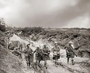 Exhausted Prints: A piper of the 7th Seaforth Highlanders leads four men of the 26th Brigade back from the trenches after the attack