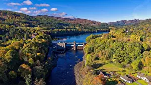 Autumn Leaves Prints: Pitlochry Perth and Kinross Scotland River Tummel the Dam Fonab Castle Hotel and trees in autumn