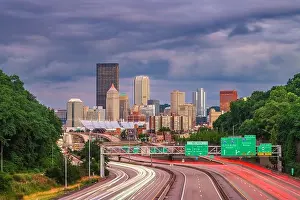 Pittsburgh, Pennsylvania, USA downtown city skyline over looking highways at dusk