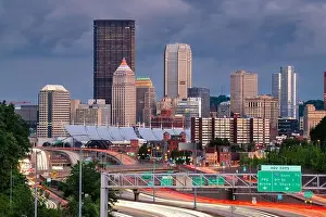 Pittsburgh, Pennsylvania, USA downtown city skyline over looking highways at dusk