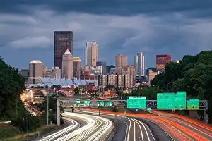 Pittsburgh, Pennsylvania, USA downtown city skyline over looking highways at dusk