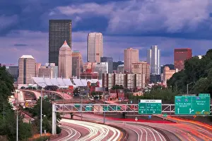 Pittsburgh, Pennsylvania, USA downtown city skyline over looking highways at dusk