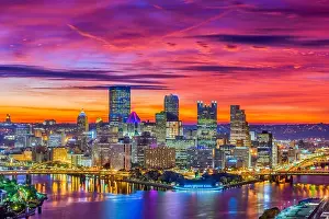 Pittsburgh, Pennsylvania, USA downtown skyline on the rivers at dawn