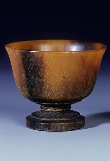 Artefact Prints: Plain circular rhino horn cup with turned stepped foot and stem