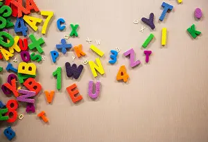 Digit Prints: Plastic Numbers and Words Hang on Board Education Concept