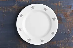 Empty plate on wooden background, top view