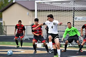 Ability Prints: Player attempting to control a corner kick in front of the opposing goal