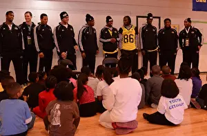 Coaching Prints: Players from the U.S. Army All-American Bowl visit children from SA Youth at St