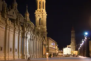 Catholic Faith Prints: Plaza del Pilar in Zaragoza Spain at night time lighted by floodlights