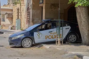 Alleyway Prints: A police car on one of the streets of Cairo in Egypt