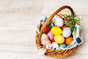 Easter Eggs Prints: Polish traditional wicker basket full of multi coloured and mottled Easter eggs