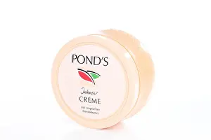 Lotion Prints: Pond's creme on isolated white studio background