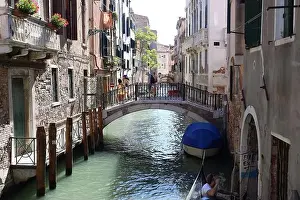 Ponte Prints: The Ponte dei Conzafelzi bridge in Venice with people walking through it during daytime