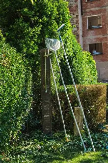 Swimming Pool Prints: Pool maintenance equipment and cleaning tools beside swimming pool in Mediterranean countryside garden
