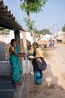 Villager Prints: Poor elderly Indian woman begging for rice at a rural indian village house