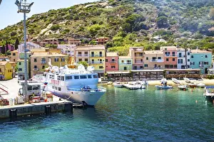 Port town of Giglio Porto with colorful row of houses, Giglio Island, Tuscany