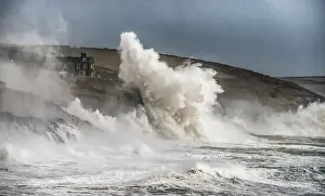 Porthleven Harbour, Storm in Cornwall with Large waves hitting the cliffs in Cornwall