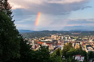 Portland, Oregon, USA downtown cityscape with a sun shower and rainbow