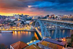 Porto, Portugal. Cityscape image of Porto, Portugal with the famous Luis I Bridge and the Douro River during dramatic sunset