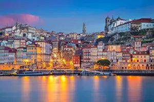 Porto, Portugal. Cityscape image of Porto, Portugal with reflection of the city in the Douro River during sunrise