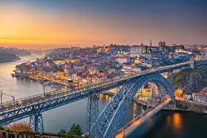 Porto, Portugal. Cityscape image of Porto, Portugal with the famous Luis Bridge and the Douro River during sunset