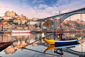 Porto, Portugal. Cityscape image of Porto, Portugal with reflection of the city in the Douro River during sunrise