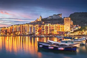 Porto Venere, La Spezia, Italy historic town skyline with Christmas lights at dusk