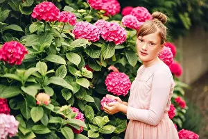 Enjoy Prints: Portrait of adorable ballerina girl playing in hydrangea garden