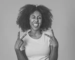 Expressions Prints: Portrait of attractive, confident african american young woman with happy facial expressions having fun posing