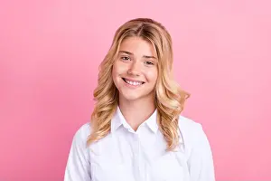 Formalwear Prints: Portrait of attractive cheerful wavy-haired preteen girl wearing white shirt isolated over pink pastel color background