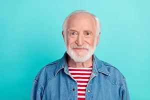 Grandpa Prints: Portrait of attractive content cheery grey-haired middle-aged man in denim jacket isolated over bright teal turquoise