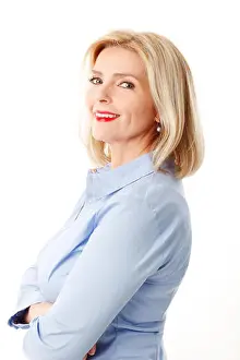 Glance Prints: Portrait of attractive middle age woman standing against white background while looking at camera