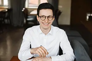 Eyeglasses Prints: Portrait of a attractive positive manager wearing white shirt