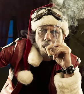Mature Adult Prints: Portrait of Bad Santa smoking a cigar