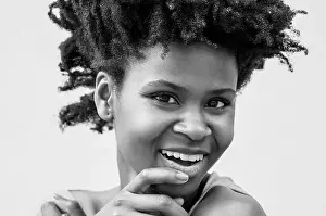 Monochrome Background Prints: Portrait of a beautiful black colombian model laughing in black and white
