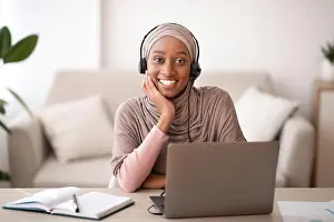 Tutor Prints: Portrait of beautiful Muslim black woman in headscarf wearing headset
